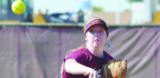 CDN | Andrew Kennedy Carly Koons makes a throw from shortstop to first base Tuesday.