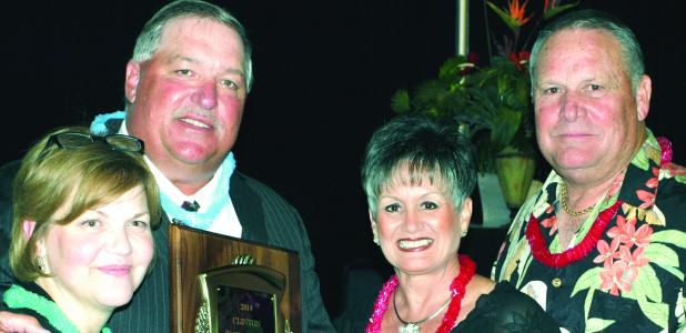 CDN | Gerald Green Coach Mike Lee shows off his plaque as Clinton’s 2014 Citizen of the Year, as well as the woman who has been at his side throughout his 24-year coaching career here, wife Patty. During those years his teams won 271 football games and nine state titles. At right are Sherry and Randy Meacham, who shared the award in 2013 for co-chairing Clinton’s big reunion.