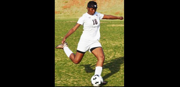 Clinton sophomore Jessica Jefferson clears the ball off the back end of the defense. Jessica Jefferson
