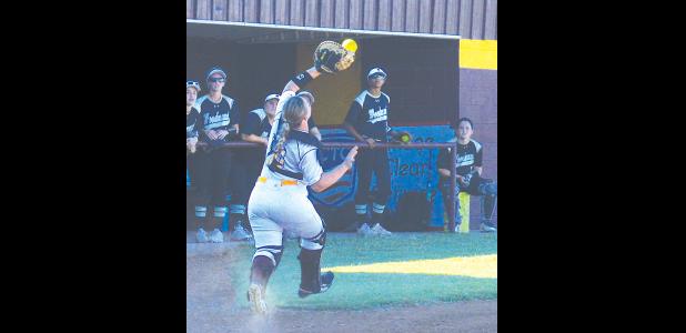 CDN | Collin Wieder Junior catcher Nikki Ray makes the catch on a Woodward foul ball. The Lady Reds piled on the fielding errors resulting in a 15-1 loss.
