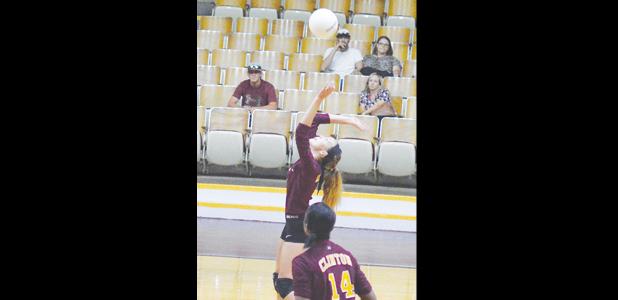  Sophomore Savannah Skiles sets up to hit a return, while freshman Jessica Jefferson looks on. 
