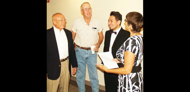 CDN | Staff Photo Everybody was in a jovial mood when this picture was snapped Friday morning at the Ward 3 candidate forum. From left are candidates Paul Brown, Leon Kinder and Chuy Rosales. They’re swapping small talk with Julie Strong, who moderated the forum.
