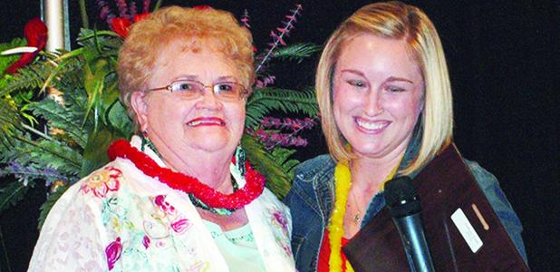 CDN | Gerald Green Gerrie Cordes, left, gets a hug and a plaque from Kelli Salazar who announces her as AMBUCS Woman of the Year.