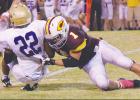 Senior linebacker Dawson Ballard flies into the backfield to make a tackle for loss on the Chickasha ballcarrier. The Reds’ defense gave up just 87 rushing yards on 29 carries.