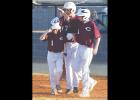  Caden Powell (No. 7) and Jackson Crumley (No. 11) celebrate with Kyler Carlisle (No. 1) after he scores the game-winning run earlier this month.