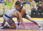 Clinton senior Daniel Lopez (right) keeps his Altus opponent off his legs in the 182 matchup. Lopez ended up losing 6-4, but he managed to wrestle for all three periods earning just a simple decision.