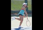 Teresa Tran swats a serve during her championship match at the Elk City Tournament. 