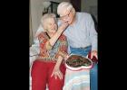 Edna and Leonard Abrahams, married 75 years, share a box of Valentine’s Day chocolates. 