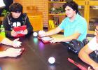 Programming their Spheros robots with their iPads are, from left, Conner Jones, Cyle Heard, Anthony Ramos and Jonathan Burrow.