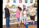 Shown preparing for Southwest Elementary’s Book Fair this week are (from left) school librarian Tina Hernandez, third-graders Ayshka Garcia and Audrina Trout, and Mary Mahan. The book fair will be held Wednesday through Friday and the following Monday, in a room near the library. It will also be open 5-7 p.m. Thursday during Literacy Night. 