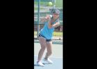 Freshman Michelle Nguyen hits a forehand shot during the Elk City Tournament.