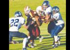  Clinton fullback Zavian Williams (No. 34) breaks through a few arm tackles before gashing the El Reno defense for a 92-yard touchdown run.